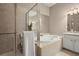Modern bathroom features a glass shower, soaking tub, and neutral tones at 2303 Waters Edge Trl, Roswell, GA 30075