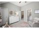 Bright Bedroom with large dresser, neutral colors, and ample space at 2303 Waters Edge Trl, Roswell, GA 30075