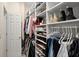 Spacious walk-in closet with ample storage for clothing and accessories at 2303 Waters Edge Trl, Roswell, GA 30075