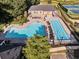 Community offers a luxurious pool area with seating, a lap pool, and well-maintained landscaping at 2303 Waters Edge Trl, Roswell, GA 30075