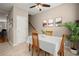 Inviting dining room with a table for four, decorative artwork, and a leafy green plant at 2303 Waters Edge Trl, Roswell, GA 30075