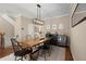 Elegant dining room featuring a modern light fixture and stylish furnishings at 2303 Waters Edge Trl, Roswell, GA 30075