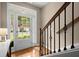 Bright entryway features hardwood floors, decorative staircase, and natural light at 2303 Waters Edge Trl, Roswell, GA 30075
