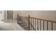 Hallway with decorative railing and view into nearby rooms at 2303 Waters Edge Trl, Roswell, GA 30075