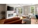 Comfortable living room with fireplace, built-ins, and neutral color palette at 2303 Waters Edge Trl, Roswell, GA 30075