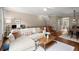 Cozy living room open to the dining area with stylish decor and ample seating at 2303 Waters Edge Trl, Roswell, GA 30075