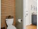 Unique powder room features wood paneling, modern fixtures, and rustic decor at 2303 Waters Edge Trl, Roswell, GA 30075