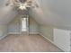 Attic space featuring carpet, ceiling fan, and an open doorway at 3426 Olivia Grace Way, Dacula, GA 30019