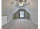 Unfinished attic space featuring carpet, a window, and sloped ceilings at 3426 Olivia Grace Way, Dacula, GA 30019