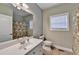 Bathroom featuring tile flooring, vanity, framed mirror and shower at 3426 Olivia Grace Way, Dacula, GA 30019
