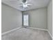 Bedroom featuring carpet flooring, ceiling fan, and window at 3426 Olivia Grace Way, Dacula, GA 30019