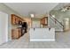 Open-concept kitchen with a breakfast bar, stainless steel appliances, and wood cabinets at 3426 Olivia Grace Way, Dacula, GA 30019