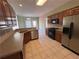 Kitchen with stainless steel appliances, gas cooktop and tile flooring at 3426 Olivia Grace Way, Dacula, GA 30019