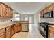 Kitchen with stainless steel appliances and view of the dining area at 3426 Olivia Grace Way, Dacula, GA 30019