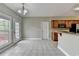 Eat-in kitchen with tile floors, wood cabinets, and access to the outdoor deck at 3426 Olivia Grace Way, Dacula, GA 30019