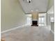 Spacious living room with a fireplace, vaulted ceilings, carpet and a large opening to the sunroom at 3426 Olivia Grace Way, Dacula, GA 30019