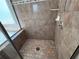 Close up of stand up shower with glass door and tiled walls at 3426 Olivia Grace Way, Dacula, GA 30019