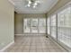 Well lit sunroom with many windows and tile flooring at 3426 Olivia Grace Way, Dacula, GA 30019