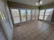 Bright sunroom features lots of natural light from the many windows at 3426 Olivia Grace Way, Dacula, GA 30019