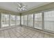 Sunroom with tile floor and large windows for lots of natural light at 3426 Olivia Grace Way, Dacula, GA 30019