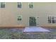 The home's backyard features a well-maintained lawn and a small patio area, perfect for outdoor relaxation at 6285 Polar Fox Ct, Riverdale, GA 30296