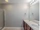 Bright bathroom features a double sink vanity and shower-tub combo for convenience at 6285 Polar Fox Ct, Riverdale, GA 30296