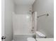 Standard full bathroom featuring a shower-tub combination, toilet, and towel rack at 6285 Polar Fox Ct, Riverdale, GA 30296