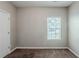 Neutral-colored bedroom with a window, carpet, and closet at 6285 Polar Fox Ct, Riverdale, GA 30296