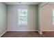 This bedroom offers natural light through its double windows and is carpeted for comfort at 6285 Polar Fox Ct, Riverdale, GA 30296