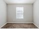 Bedroom featuring neutral paint, carpet floors, and a window with blinds at 6285 Polar Fox Ct, Riverdale, GA 30296