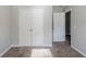 Bedroom featuring neutral paint, carpet floors, and closet doors at 6285 Polar Fox Ct, Riverdale, GA 30296