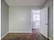 Bedroom features neutral paint and carpet floors, with a view to the hallway at 6285 Polar Fox Ct, Riverdale, GA 30296