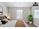 Bright bedroom features a large window and neutral decor, creating a peaceful retreat at 6285 Polar Fox Ct, Riverdale, GA 30296