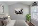 This staged bedroom is bright and spacious, featuring contemporary decor at 6285 Polar Fox Ct, Riverdale, GA 30296