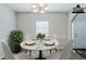 Staged dining room with furniture and decor at 6285 Polar Fox Ct, Riverdale, GA 30296