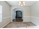 Bright dining room featuring plush carpeting and archway to the front entrance at 6285 Polar Fox Ct, Riverdale, GA 30296