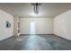 Spacious garage with concrete floors and a door at 6285 Polar Fox Ct, Riverdale, GA 30296