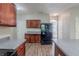Spacious kitchen with wood cabinets, modern appliances, and neutral countertops at 6285 Polar Fox Ct, Riverdale, GA 30296