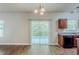 Bright kitchen with a large sliding glass door and a simple lighting fixture at 6285 Polar Fox Ct, Riverdale, GA 30296