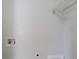A laundry area is shown, with connections and a shelf for organizing laundry essentials at 6285 Polar Fox Ct, Riverdale, GA 30296