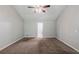 Living room with neutral carpet and ceiling fan is ready for a new owner to move right in at 6285 Polar Fox Ct, Riverdale, GA 30296