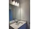 Bathroom with a white vanity, large mirror, and modern faucet at 101 Pearl St, Woodstock, GA 30188