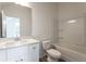 Modern bathroom featuring a quartz vanity and a white toilet and shower combo at 101 Pearl St, Woodstock, GA 30188