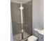 Modern bathroom with glass-door shower and gray tiled walls at 101 Pearl St, Woodstock, GA 30188
