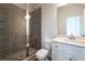 Modern bathroom with tiled shower, quartz countertop and a white toilet at 101 Pearl St, Woodstock, GA 30188