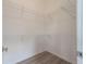 A walk-in closet with white walls, wire shelving and modern wood flooring at 101 Pearl St, Woodstock, GA 30188