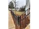 Cozy home exterior featuring a black wooden fence along the sidewalk at 101 Pearl St, Woodstock, GA 30188