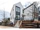 Striking exterior with modern design, black window accents, and a landscaped front yard at 101 Pearl St, Woodstock, GA 30188