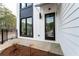 Close-up of the front entrance, showcasing modern architecture and clean, minimalist design at 101 Pearl St, Woodstock, GA 30188