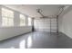 Spacious two-car garage with an automatic door and plenty of natural light at 101 Pearl St, Woodstock, GA 30188